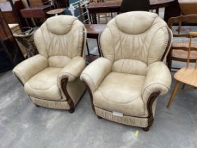 A PAIR OF 'FLORENCE COLLECTIONS' (MADE IN ITALY) CREAM LEATHER EASY CHAIRS, ON TURNED LEGS