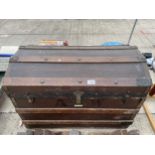 A VINTAGE WOODEN DOME TOP TRUNK BEARING THE LABEL TODD BROS