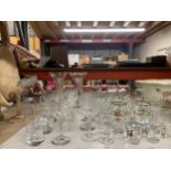 A COLLECTION OF GLASSES, BRANDED SHOT GLASSES ETC