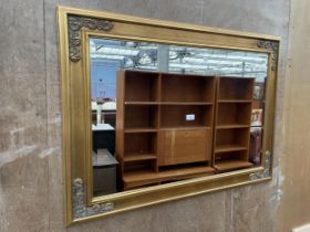 A MODERN GILT FRAMED BEVEL EDGE WALL MIRROR, 43 X 31"