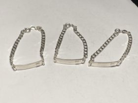 THREE SMALL SILVER I.D BRACELETS