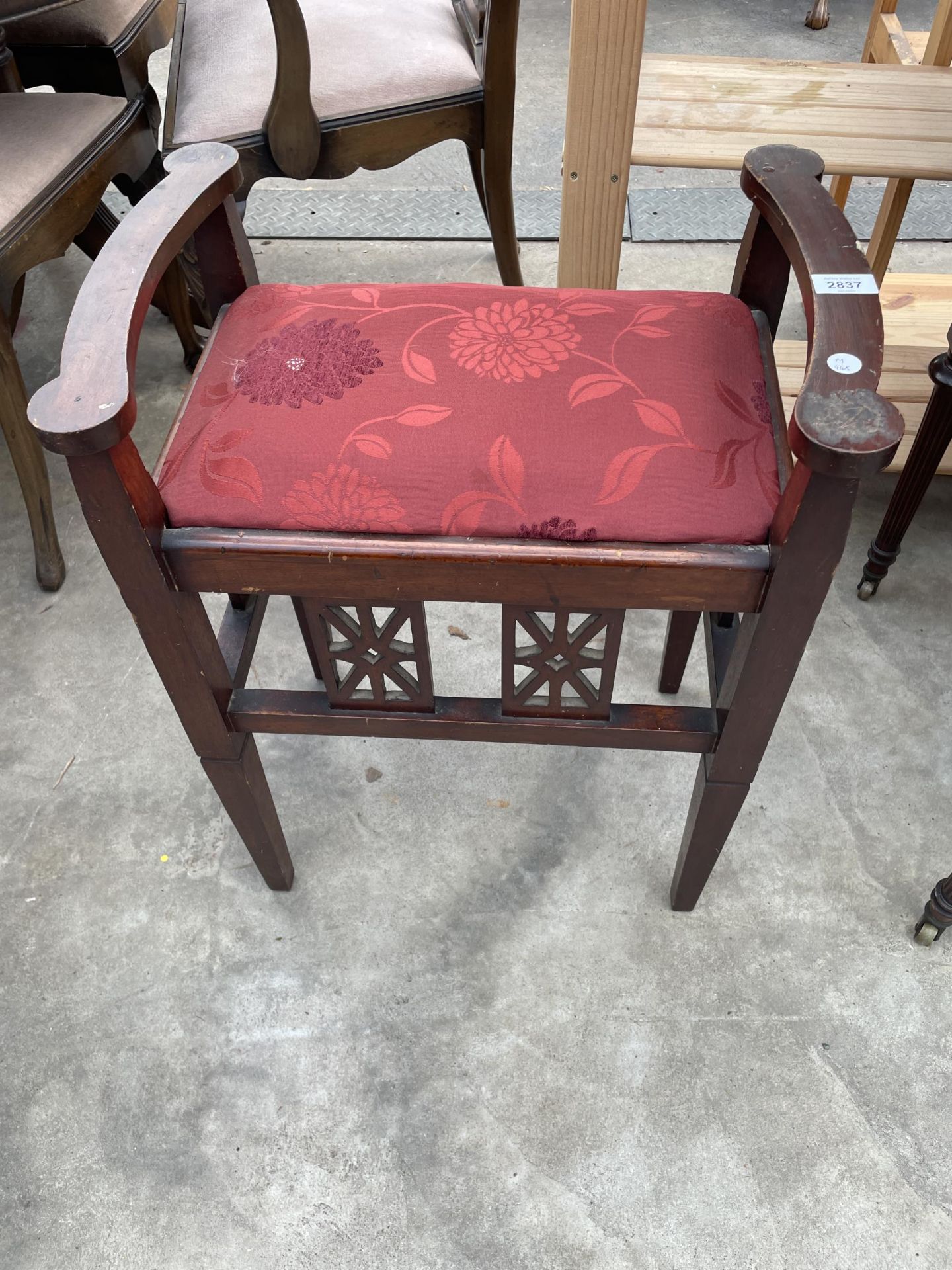 AN EDWARDIAN MAHOGANY PIANO STOOL