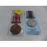 A GEORGE VI LONG SERVICE AND GOOD CONDUCT POLICE MEDAL AND A GEORGE V SPECIAL CONSTABULARY MEDAL