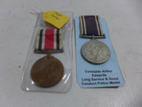 A GEORGE VI LONG SERVICE AND GOOD CONDUCT POLICE MEDAL AND A GEORGE V SPECIAL CONSTABULARY MEDAL