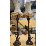 A PAIR OF ART NOUVEAU DESIGN METAL TABLE LAMPS AND SHADES WITH LEAF DESIGN BASES
