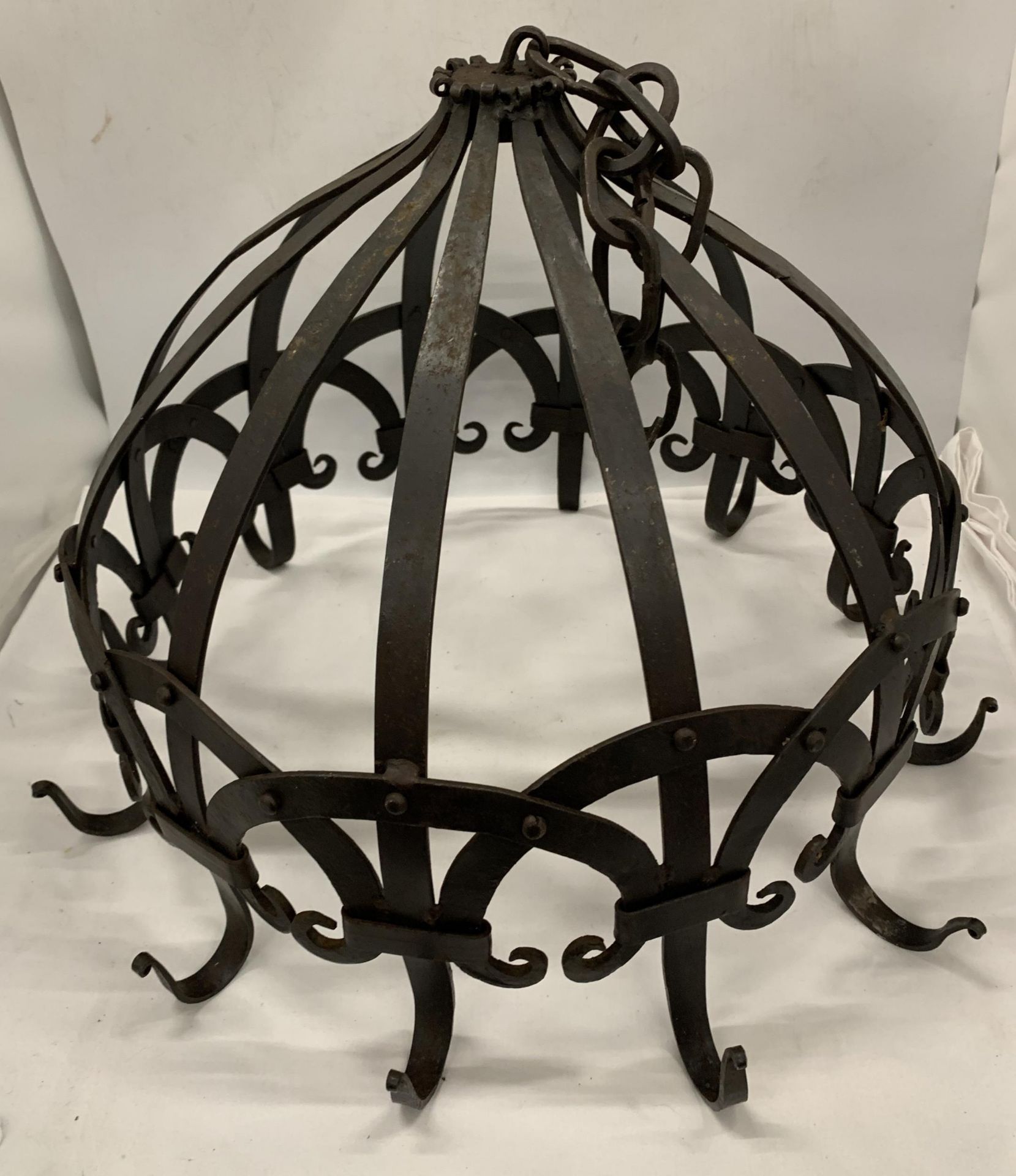 A CAST METAL HANGING GARDEN LANTERN