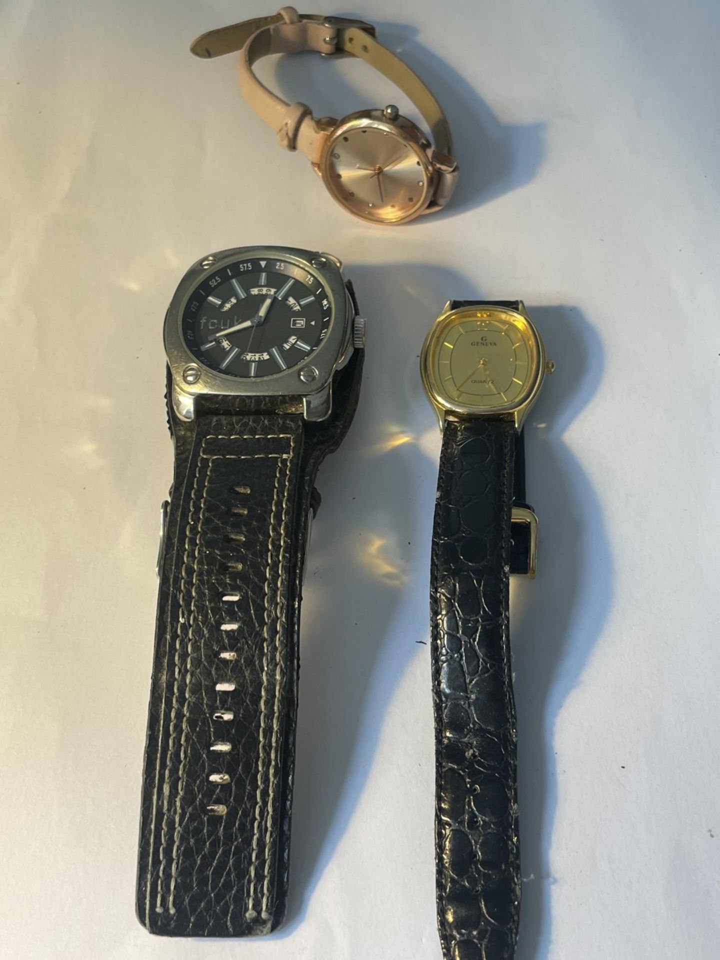 THREE WATCHES TO INCLUDE AN FCUK AND A GENEVA