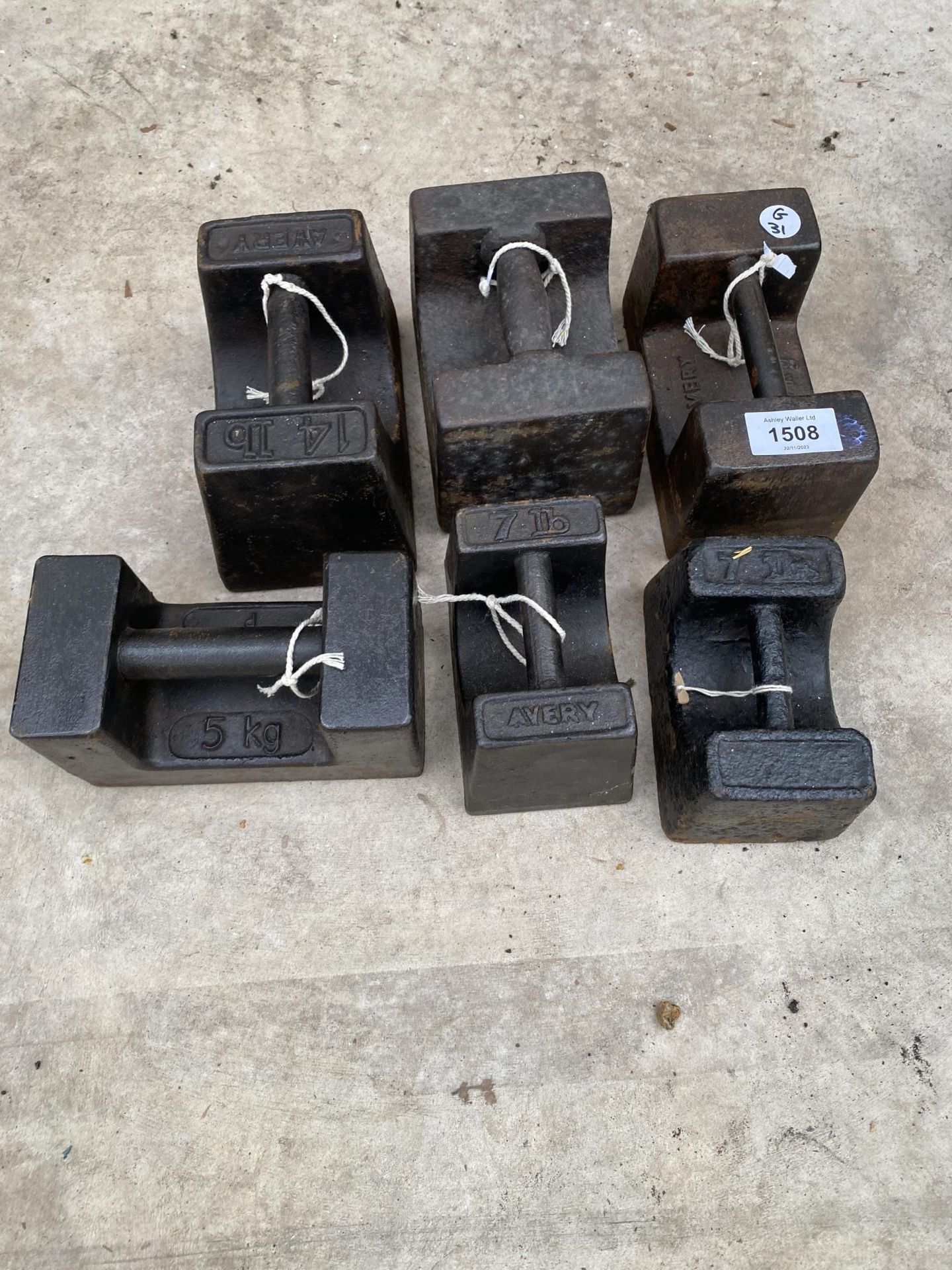 SIX ASSORTED CAST IRON WEIGHTS TO INCLUDE 14LB AND 7 LB