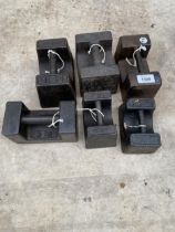 SIX ASSORTED CAST IRON WEIGHTS TO INCLUDE 14LB AND 7 LB