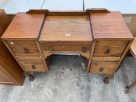 A MID 20TH CENTURY OAK KNEE HOLE DRESSING TABLE BASE, 38" WIDE ON CABRIOLE LEGS