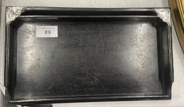 A VINTAGE EBONY DRESSING TRAY WITH HALLMARKED SILVER CORNERS