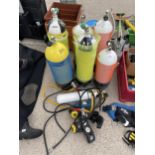 AN ASSORTMENT OF SCUBA DIVING BREATHING EQUIPMENT TO INCLUDE TANKS AND MOUTH PIECES ETC