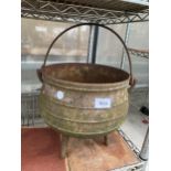 A VINTAGE CAST IRON TRI FOOTED CAULDRON POT