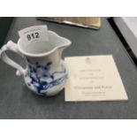 A ROYAL WORCESTER FOR COMPTON WOODHOUSE SMALL BLUE AND WHITE JUG WITH CERTIFICATE