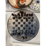 A AFRICAN DESIGN CHESS SET AND BOARD