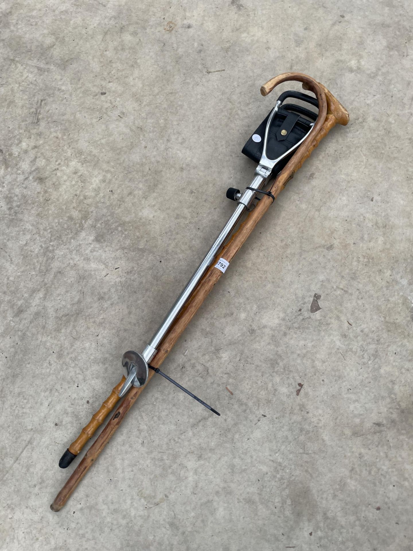 TWO WOODEN WALKING STICKS AND A SHOOTING STICK SEAT