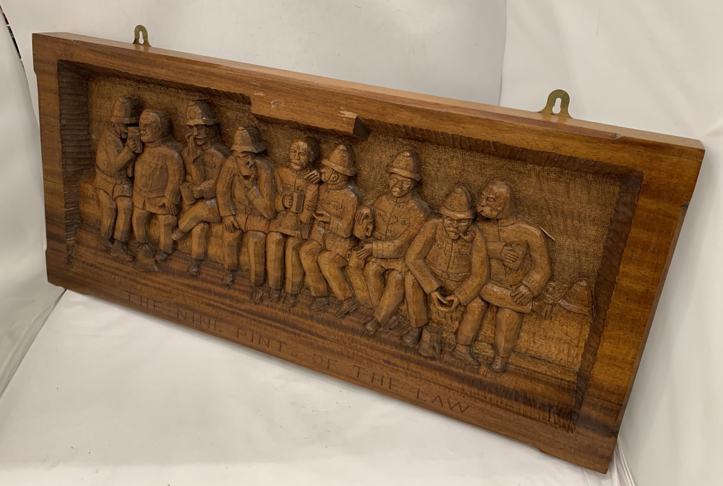 A LARGE CARVED WOODEN 'THE NINE PINTS OF THE LAW' POLICEMAN PLAQUE