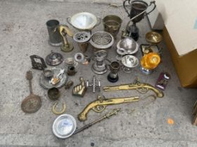 AN ASSORTMENT OF METAL WARE ITEMS TO INCLUDE A BRASS DUCK, TROPHIES AND CANDLESTICKS ETC