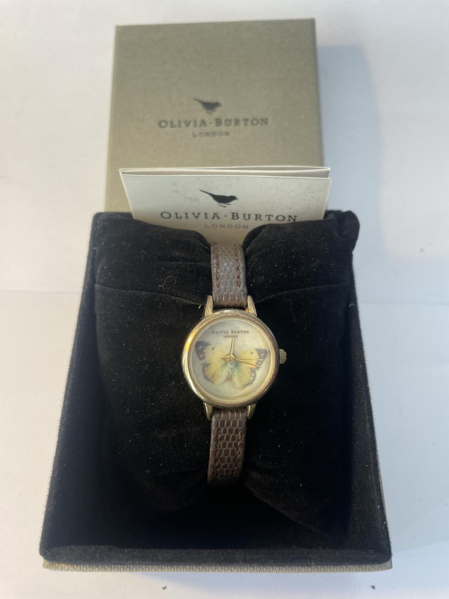 AN AS NEW AND BOXED OLIVIA BURTON BUTTERFLY WATCH SEEN WORKING BUT NO WARRANTY