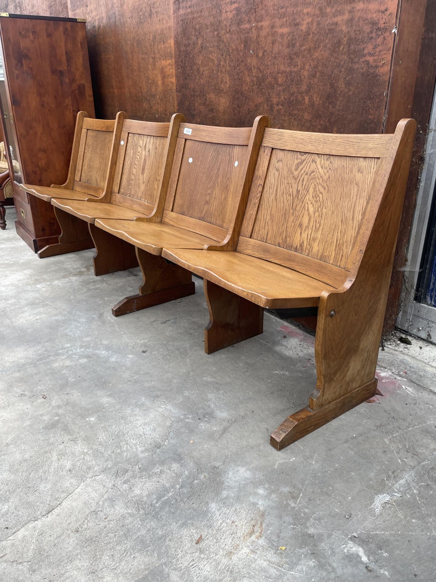 A SET OF FOUR JOINED OAK CINEMA / THEATRE SEATS WITH CURVED TOP RAIL, 81.5" WIDE - Image 2 of 4