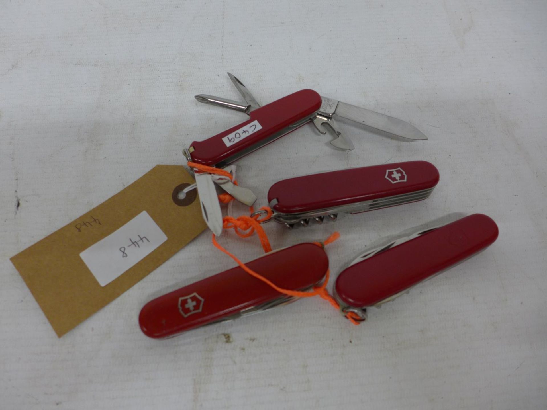 FOUR VICTORINOX SWISS ARMY KNIVES