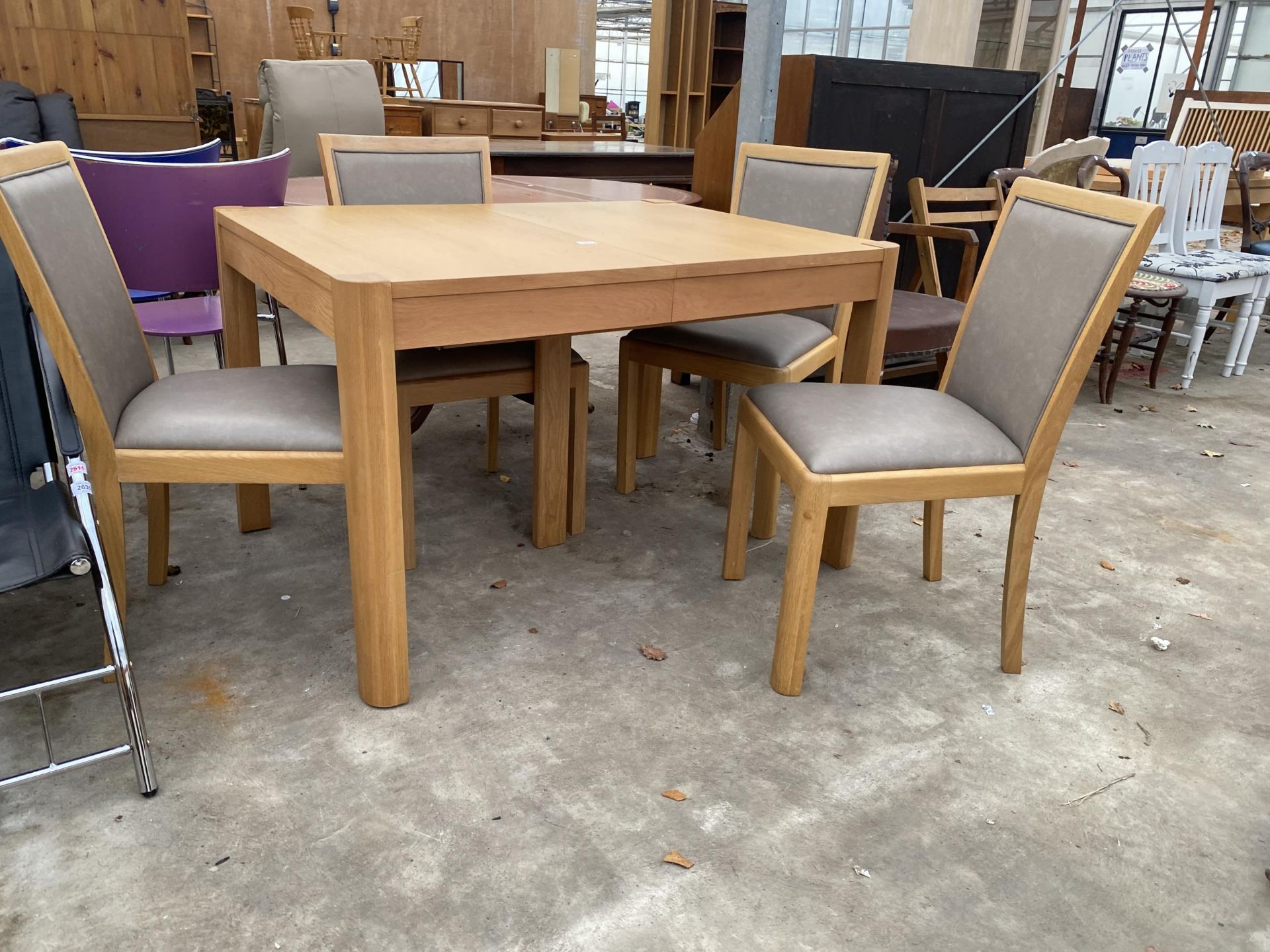 A MODERN OAK 'WINSOR' EXTENDING DINING TABLE, 48 X 36" LEAF 20") AND FOUR MATCHING DINING CHAIRS - Image 2 of 4