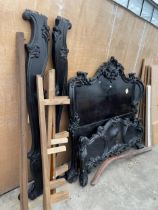 A VICTORIAN STYLE 5' 6" BEDSTEAD WITH CARVED FOLIATE DECORATION TO THE HEADBOARD AND FOOTBOARD