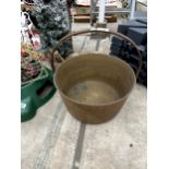 A VINTAGE BRASS JAM PAN WITH STEEL HANDLE