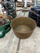 A VINTAGE BRASS JAM PAN WITH STEEL HANDLE