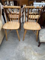 A PAIR OF 1960S BEECH DINING CHAIRS WITH KANDYA PAPER LABEL