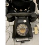 A VINTAGE BAKELITE TELEPHONE WITH PULL OUT TRAY AND HOLMES CHAPEL NUMBER