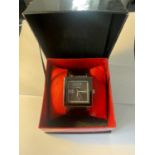 AN AS NEW AND BOXED FUBU WRISTWATCH SEEN WORKING BUT NO WARRANTY