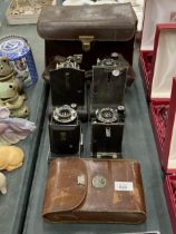 FOUR VINTAGE KODAK BELLOWS CAMERAS WITH TWO LEATHER CASES
