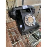 A VINTAGE BAKELITE DIAL TELEPHONE