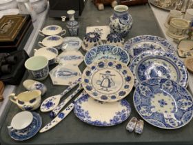 A LARGE QUANTITY OF BLUE AND WHITE CERAMICS TO INCLUDE FISH TILES, SOUP COUPES, JELLY MOULDS,