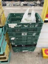 AN ASSORTMENT OF PLASTIC STACKING CRATES