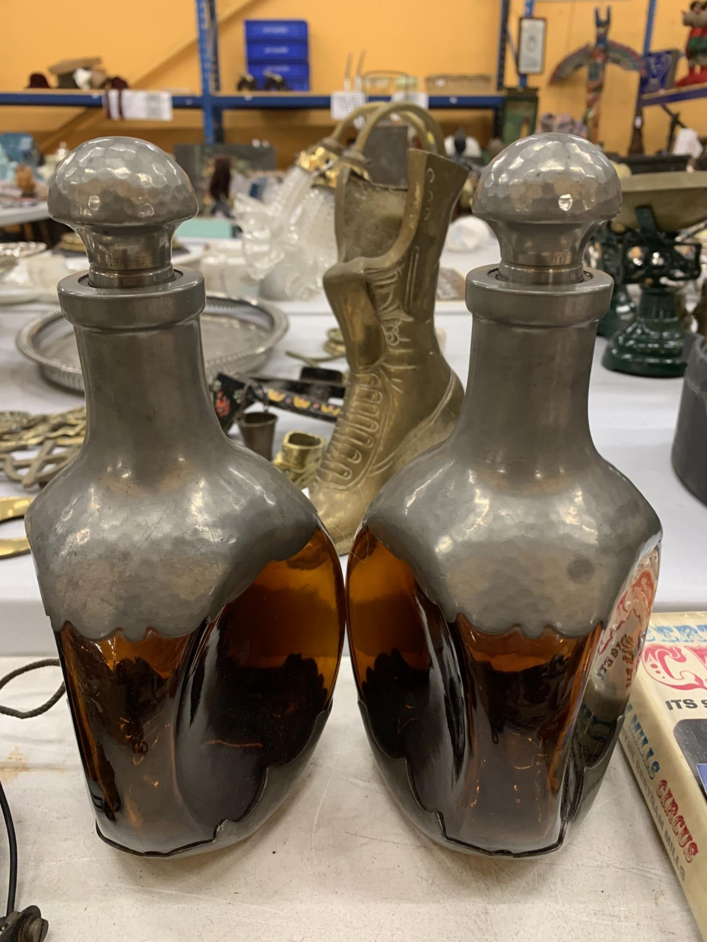 A PAIR OF DUTCH AMBER COLOURED THREE SIDED DECANTERS WITH PEWTER BASE AND TOP, HEIGHT 25CM - Image 2 of 4