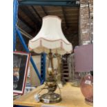 A LARGE BRASS TABLE LAMP WITH SHADE