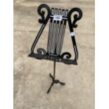 A DECORATIVE TRIPOD MUSIC STAND