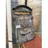 A SMALL CAST METAL LETTER BOX