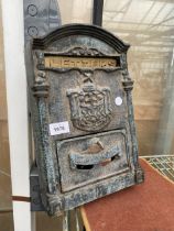 A SMALL CAST METAL LETTER BOX