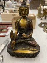 A BRONZE TIBETAN HEALING BUDDAH