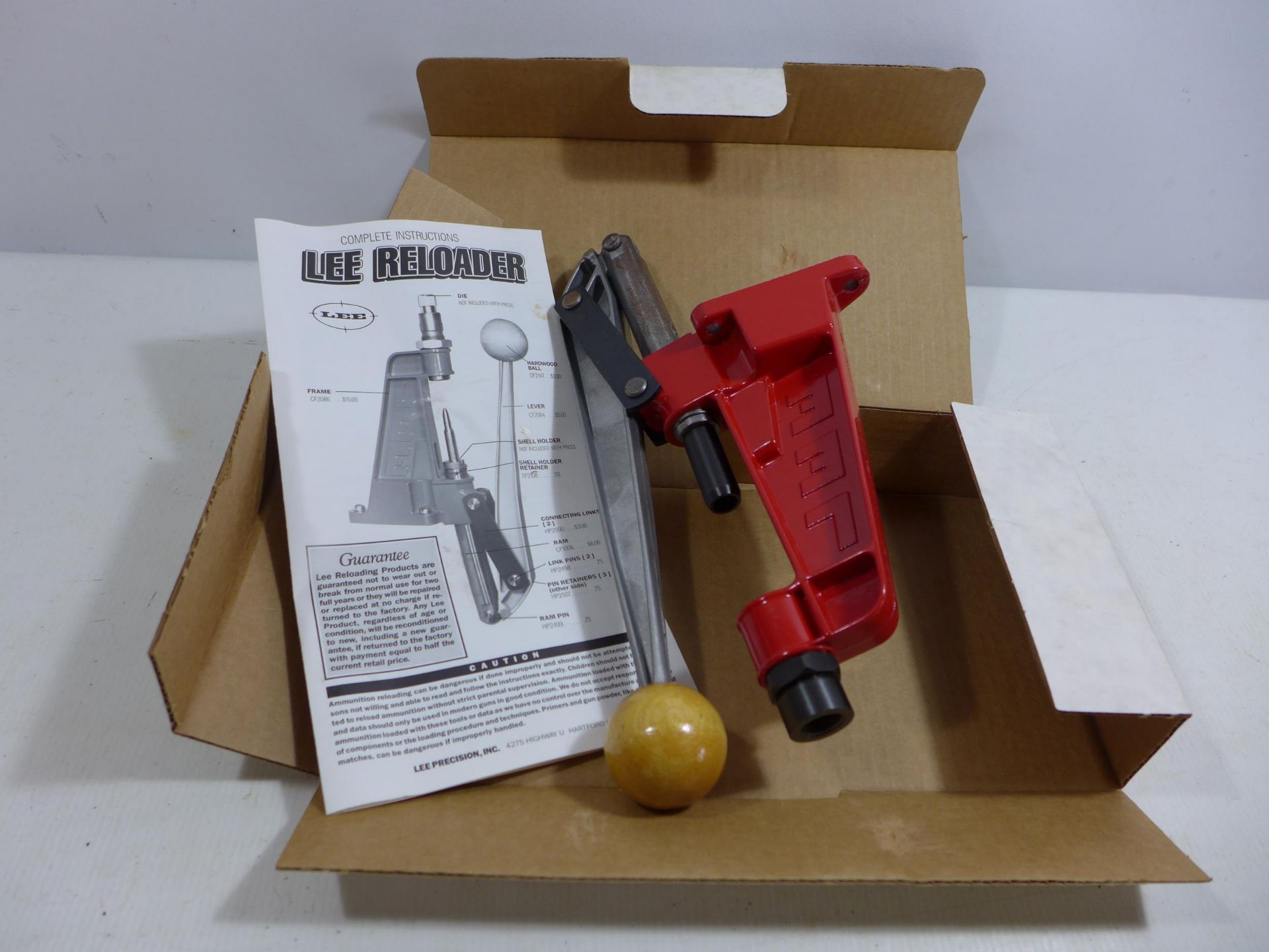 A BOXED LEE RELOADER WITH BUILT IN PRIMER CATCHER