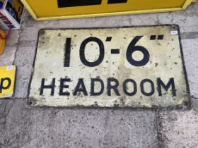 A VINTAGE TIN 10' 6" HEADROOM SIGN