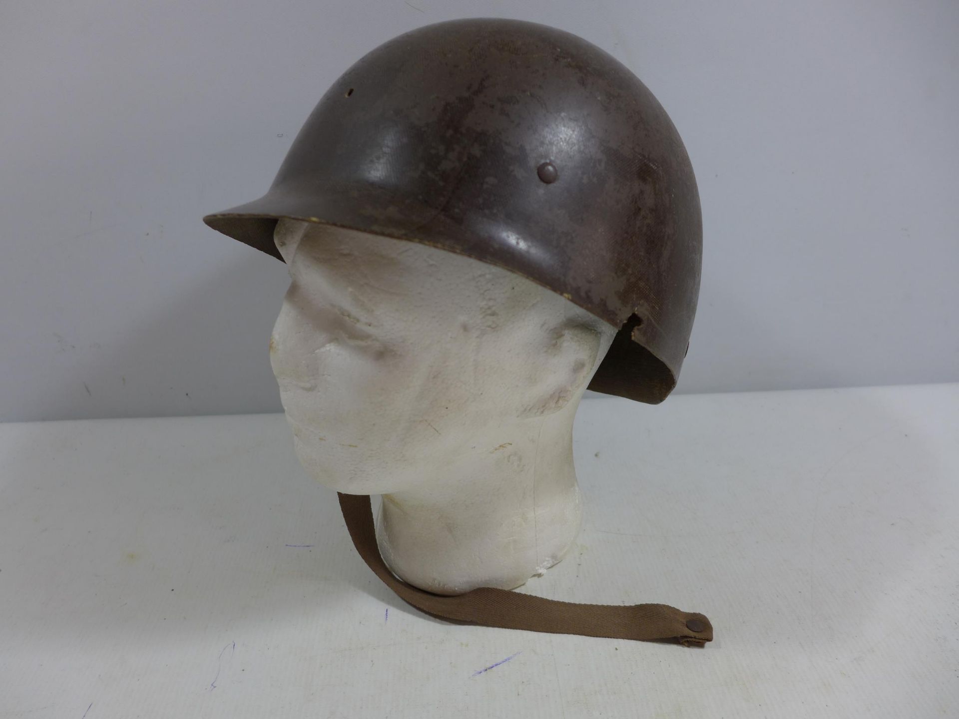 A MILITARY HELMET AND LINER