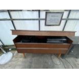 A RETRO TEAK RADIOGRAM WITH RECORD DECK AND BUSH SOLID STATE STEREO