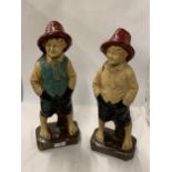 A PAIR OF VINTAGE BRITISH POTTERY GARDEN STATUES OF A BOY AND GIRL, IMPRESSED MARKS TO BASE,