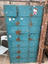 A LARGE METAL 24 SECTION LOCKER UNIT