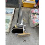 AN ASSORTMENT OF BRUSHES AND A LITTER PICKER