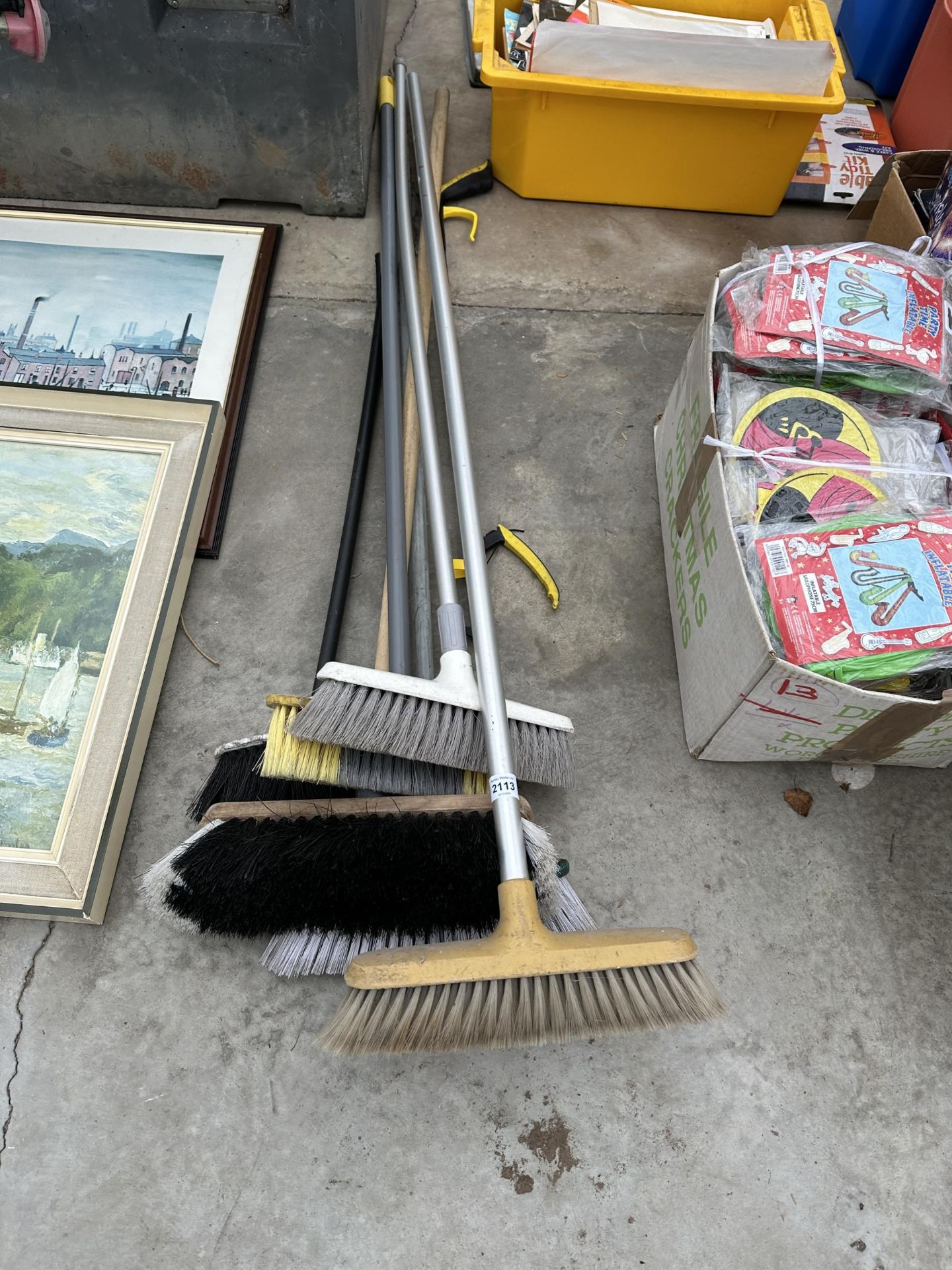 AN ASSORTMENT OF BRUSHES AND A LITTER PICKER
